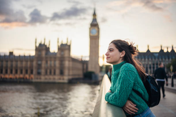 Woman tourist with camera exploring London